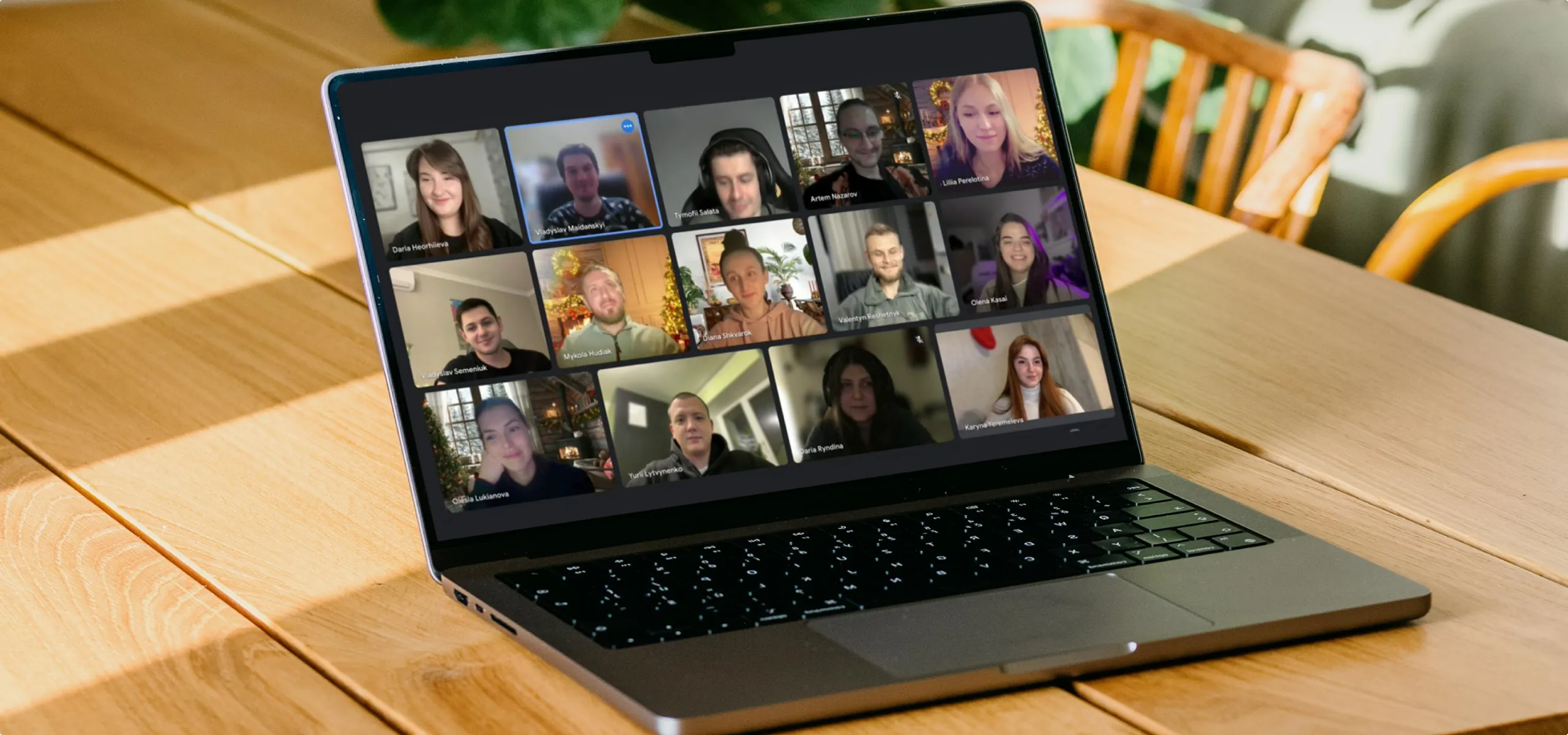 UX Design Agency: A laptop screen displays a team participating in a virtual meeting.